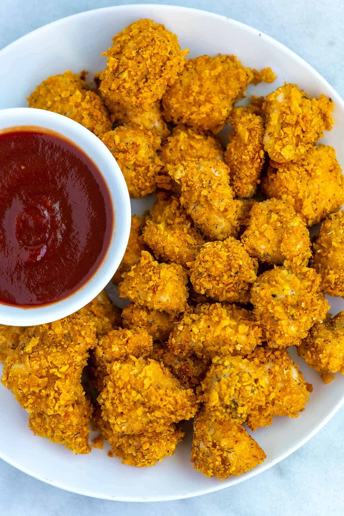 A plate of Popcorn Chicken with crispy coating that was baked 