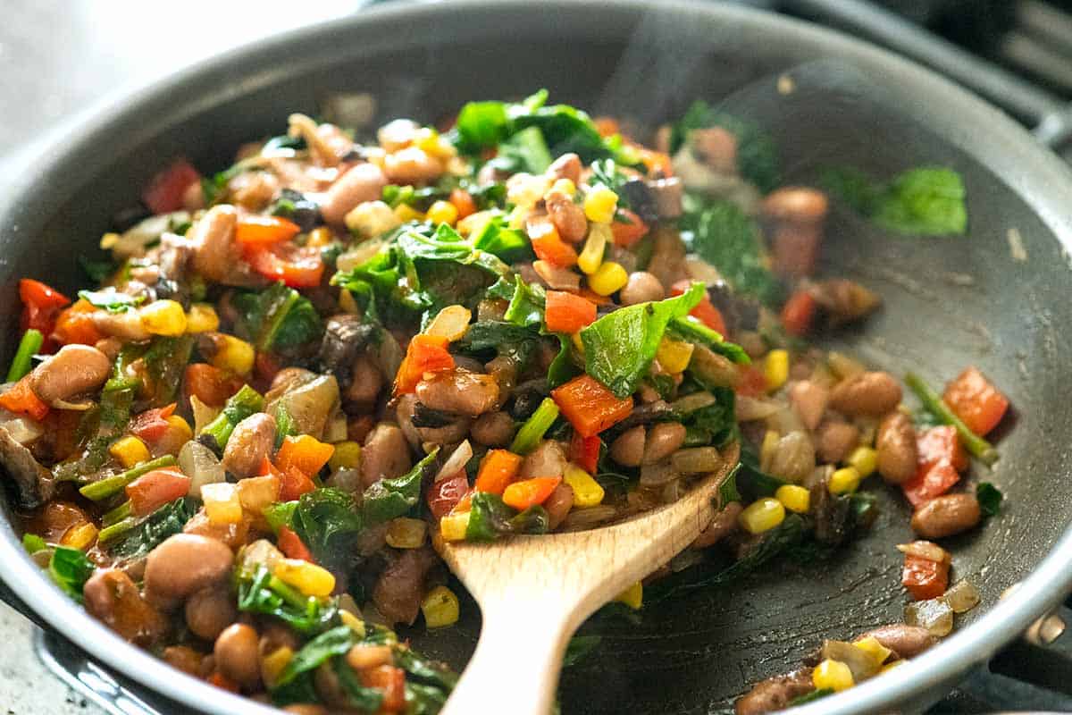 Enchilada filling made with vegetables and pinto beans