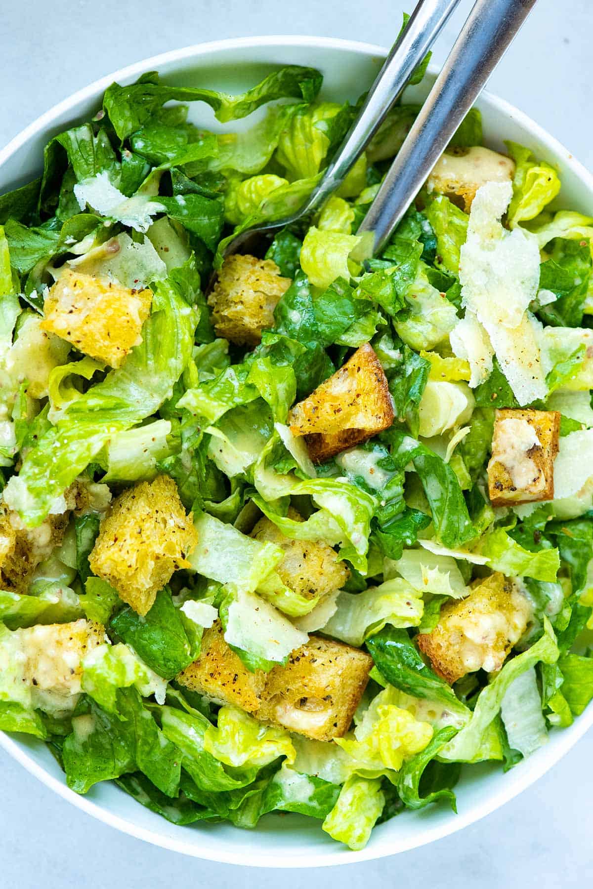 Caesar Salad ready to eat with homemade dressing, croutons and parmesan