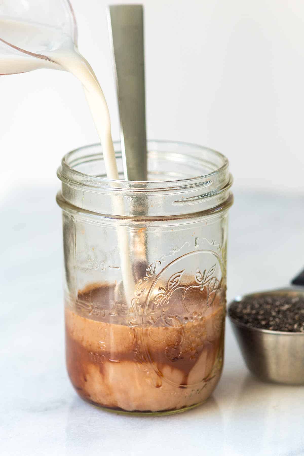 Adding non-dairy milk to cocoa for chia pudding