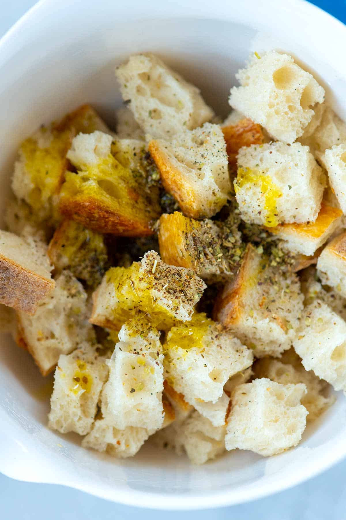 How to Make Croutons: Cubed bread tossed with olive oil, salt, pepper and herbs.