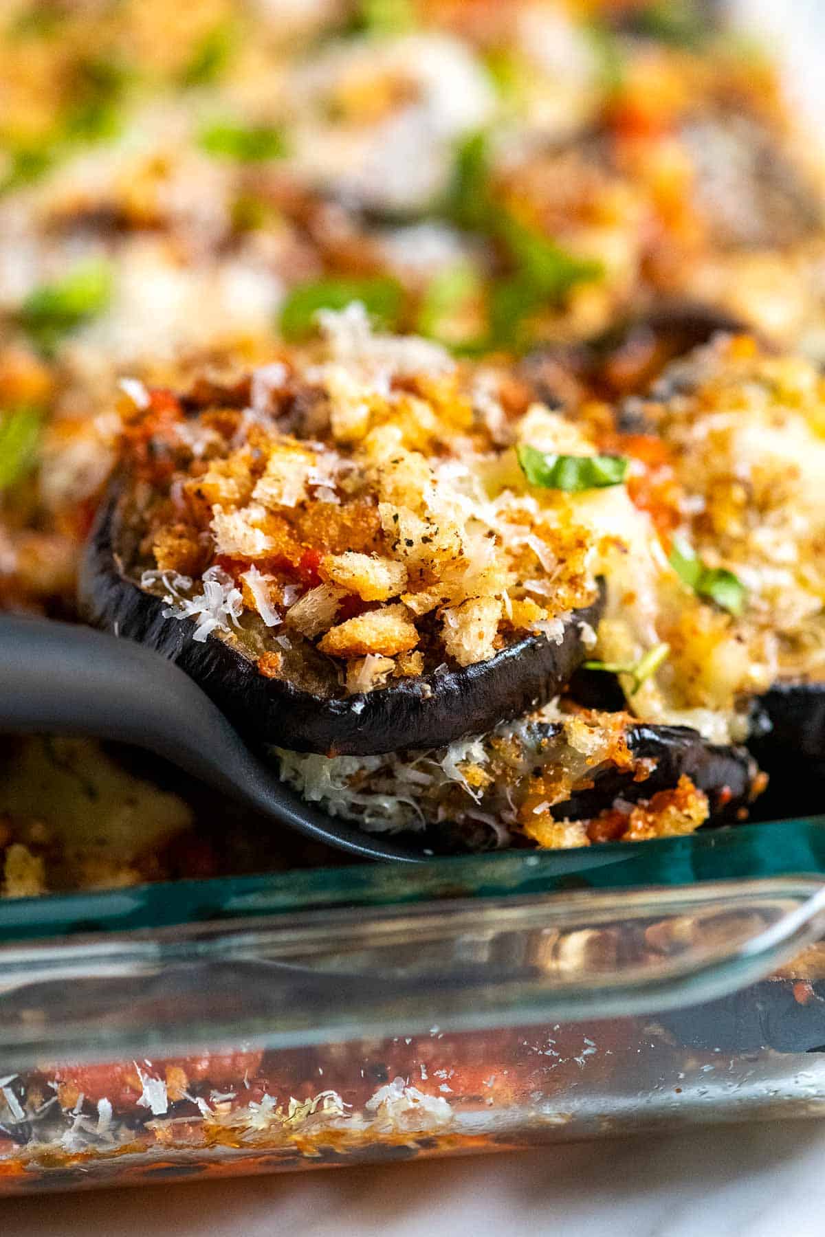 Serving baked eggplant parmesan