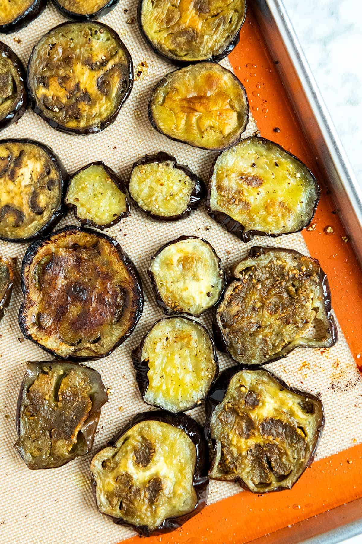 Roasted eggplant slices ready for baked eggplant parmesan