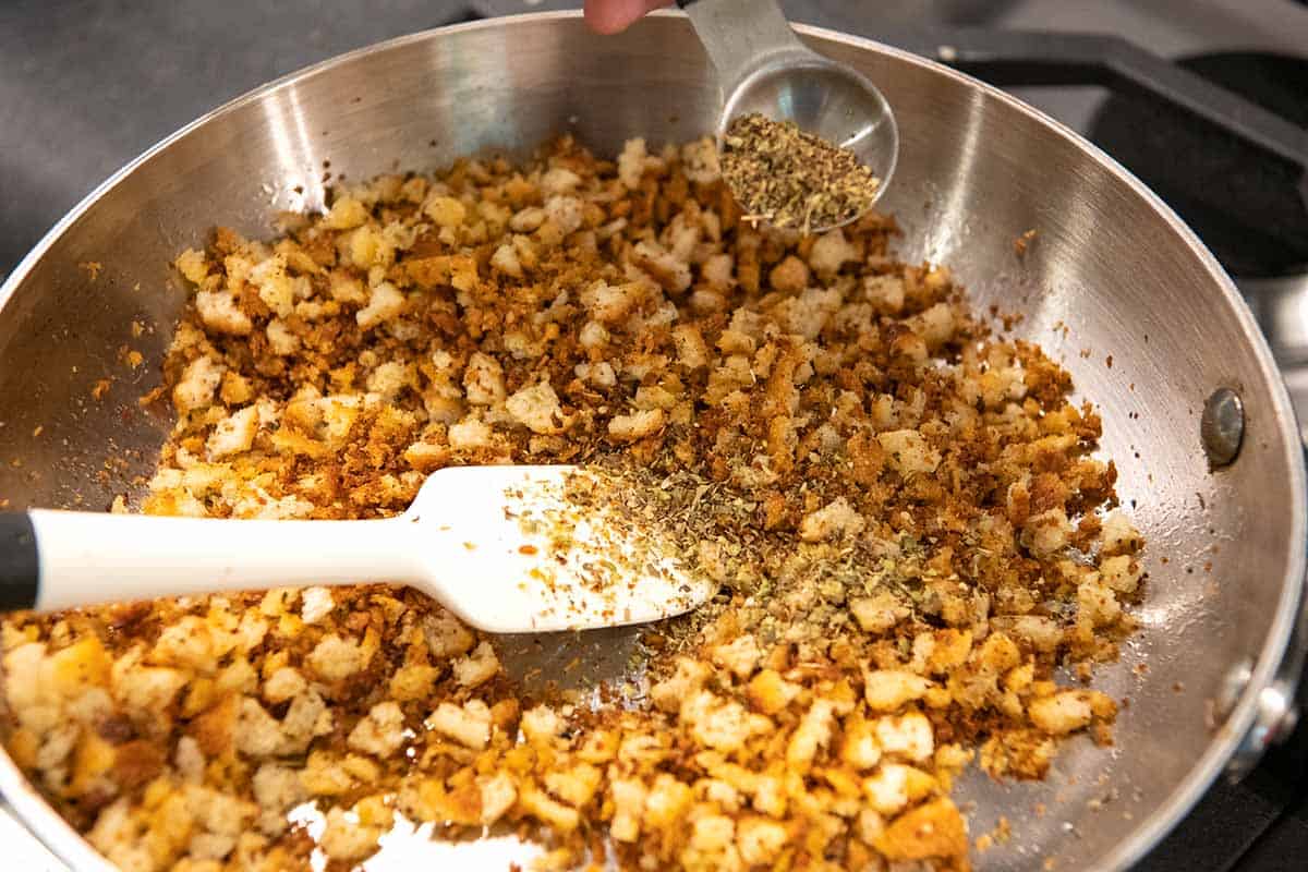 Adding spices to the bread crumbs