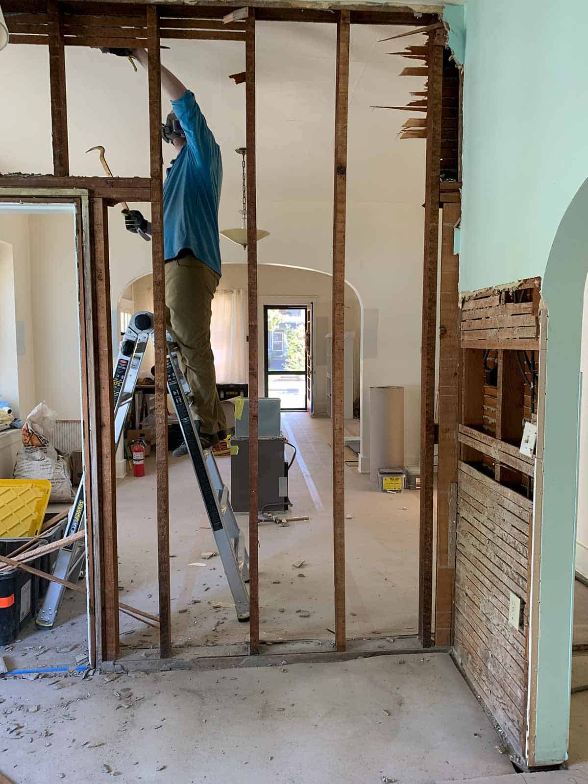 Demoing a wall in the kitchen