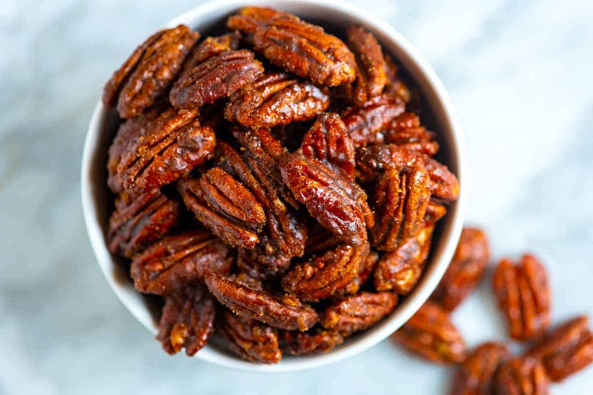 A bowl of candied pecans.