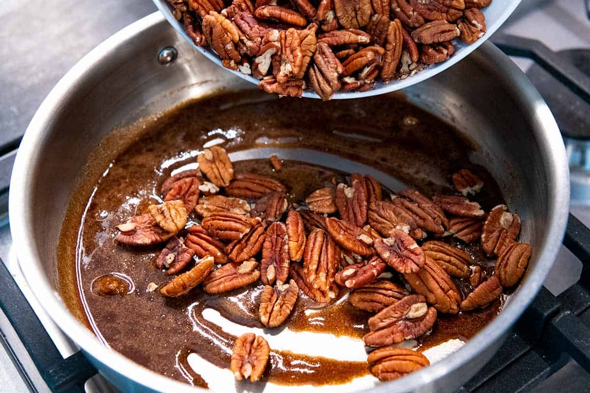 How to Make Stovetop Candied Pecans: Adding pecans to brown sugar and spices for candied pecans.