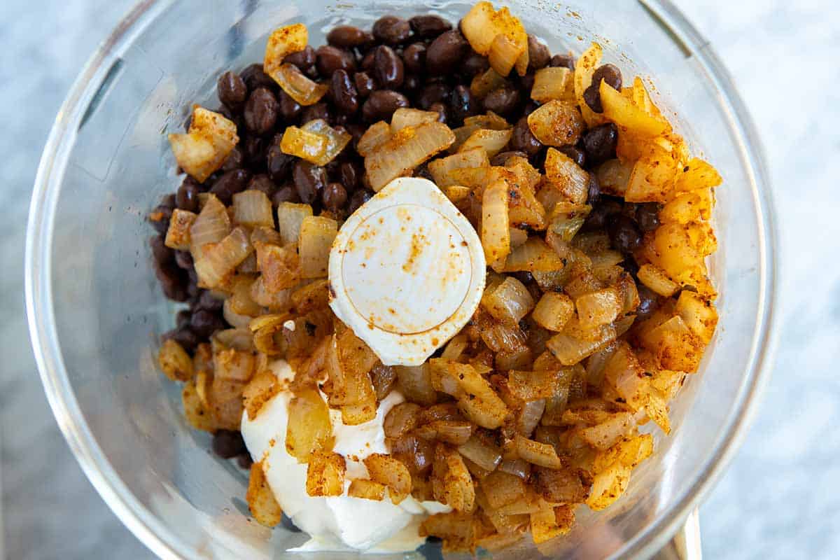 Making black bean dip in a food processor