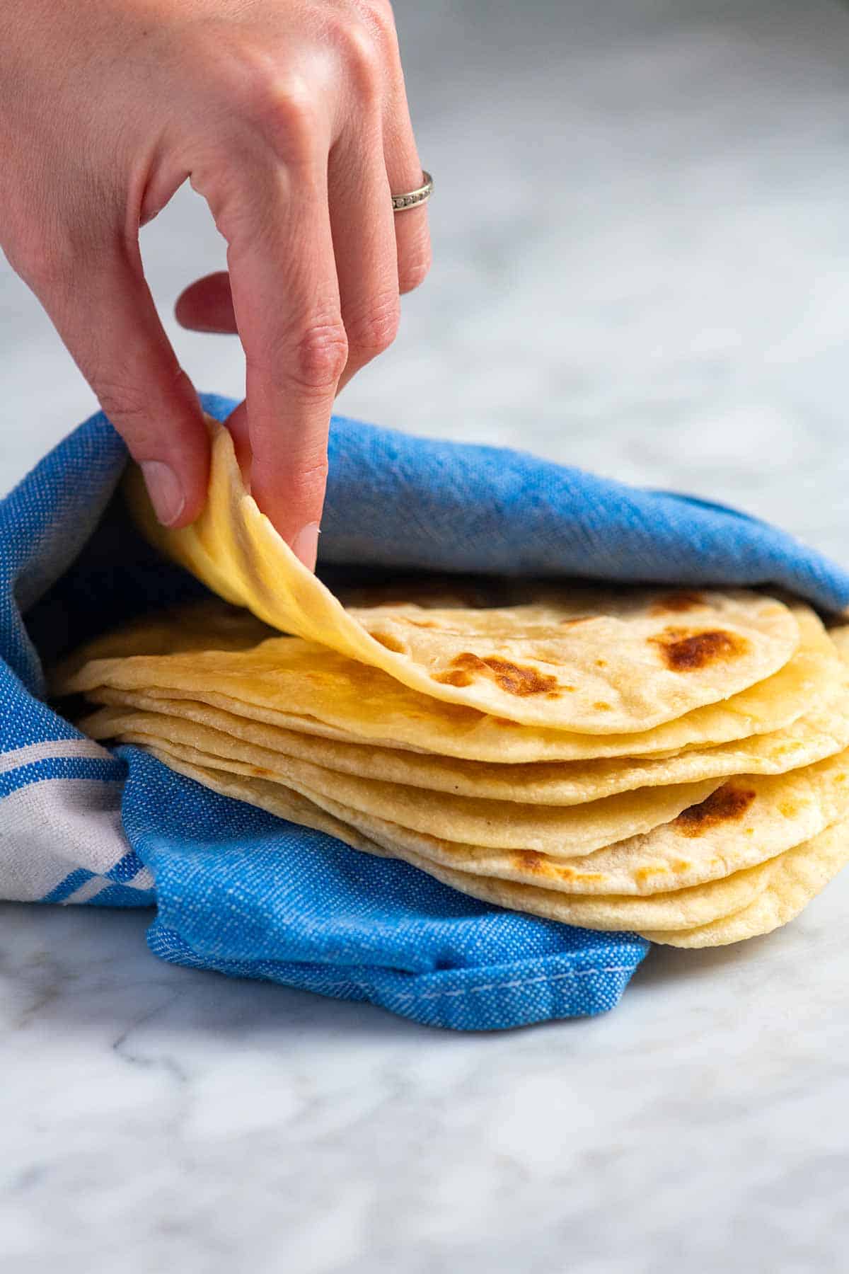 A stack of homemade flour tortillas