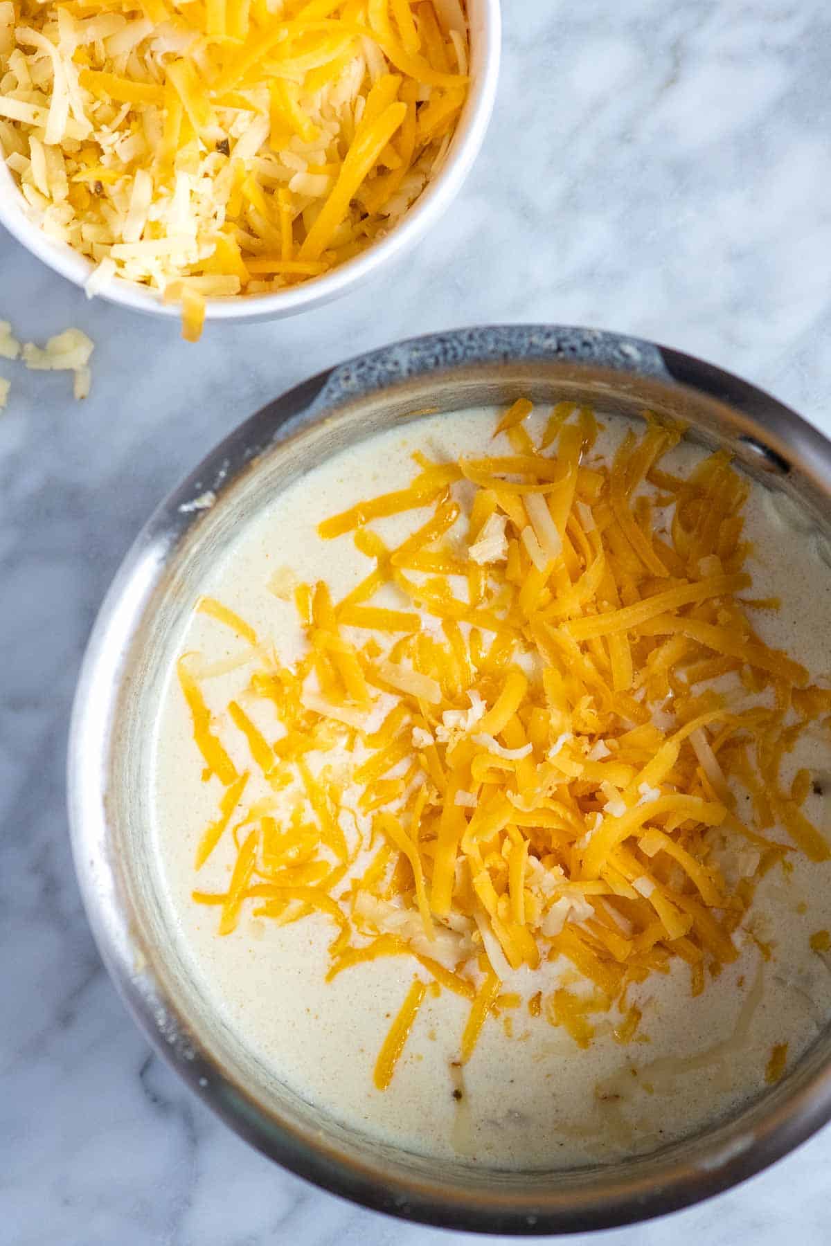 Adding cheese to make queso dip