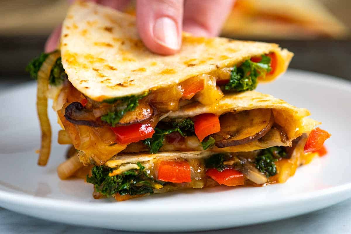 Quesadillas with melted cheese and spiced vegetables