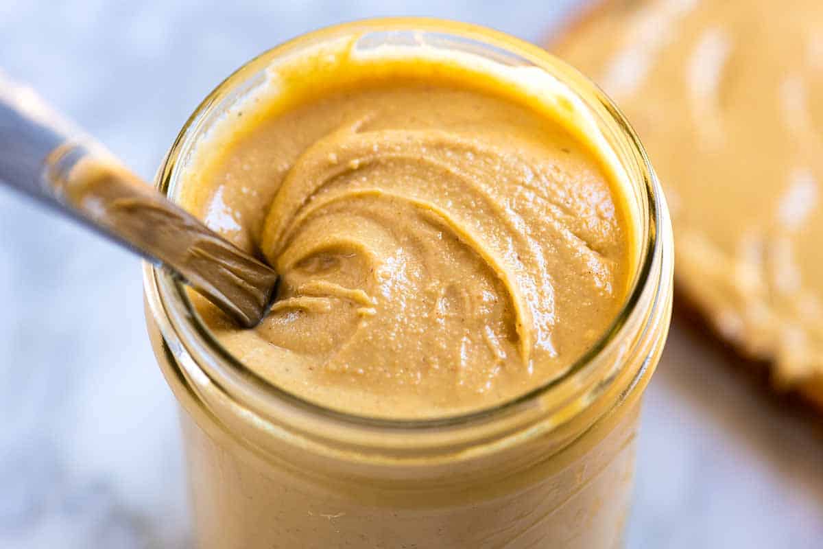Homemade cashew butter in a jar ready to be stored.