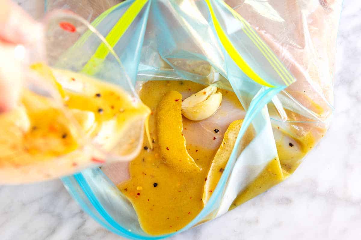 Chicken marinating in a lemon marinade