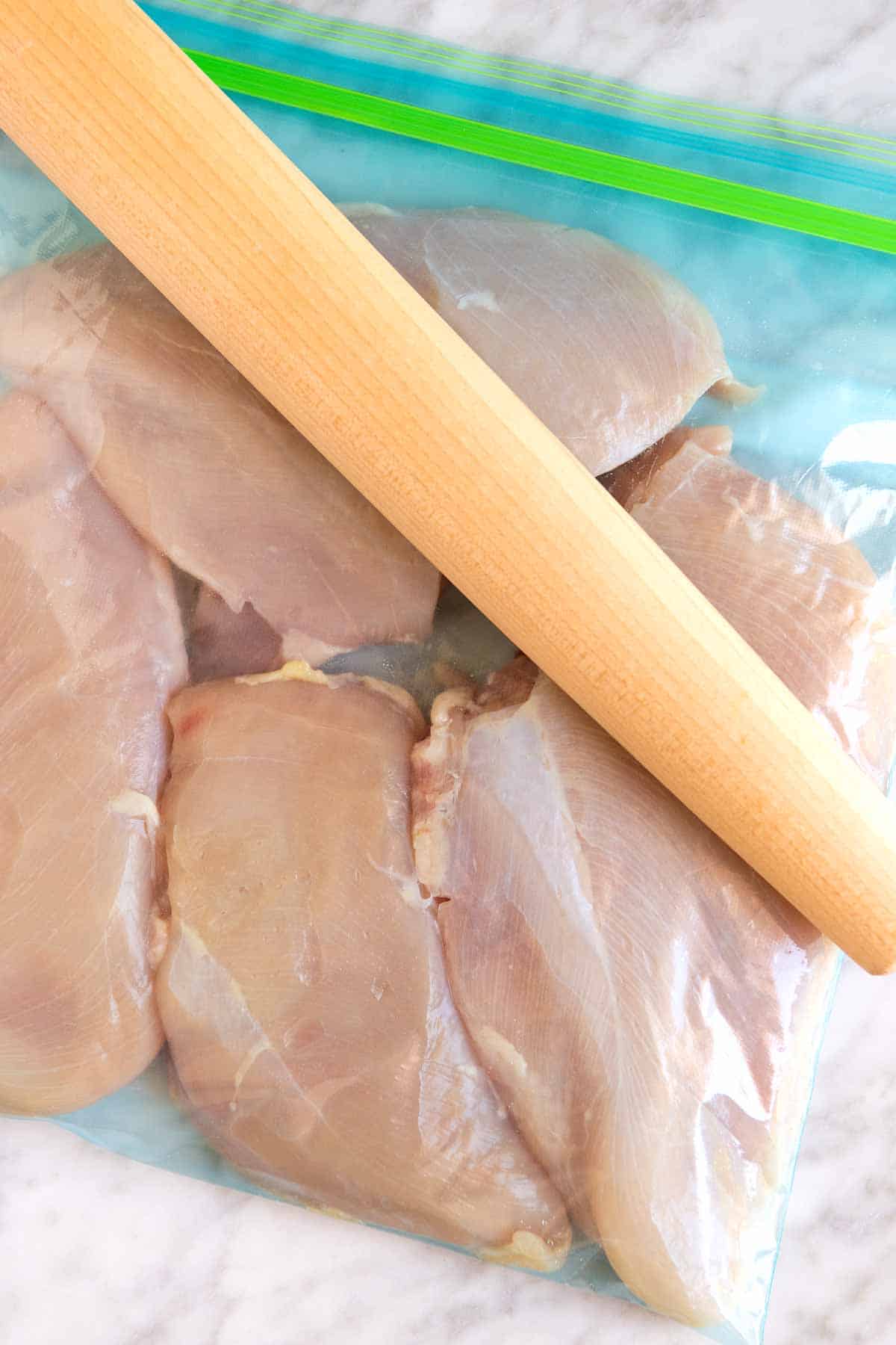 Pounding chicken breasts before grilling