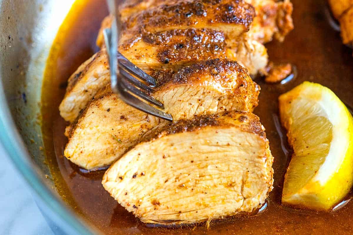 Sliced chicken breasts with pan juices
