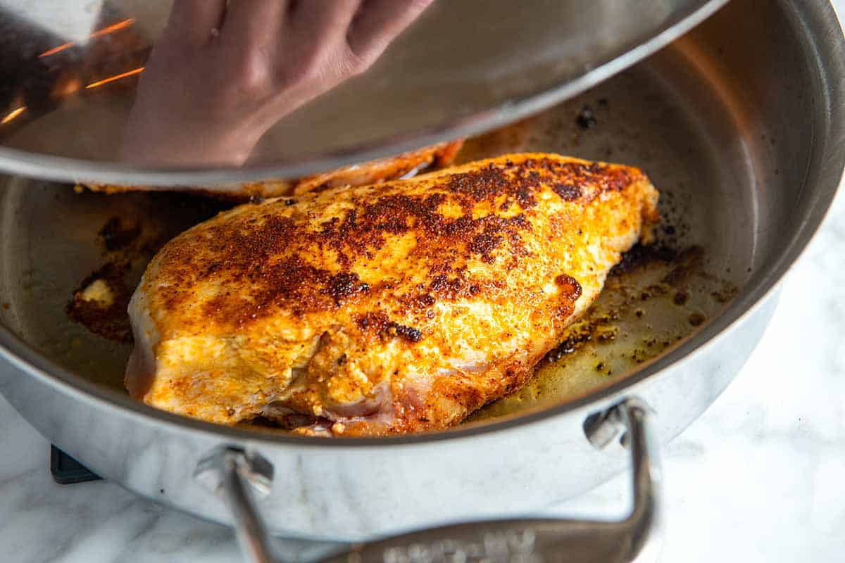 Cooking chicken breasts in a skillet