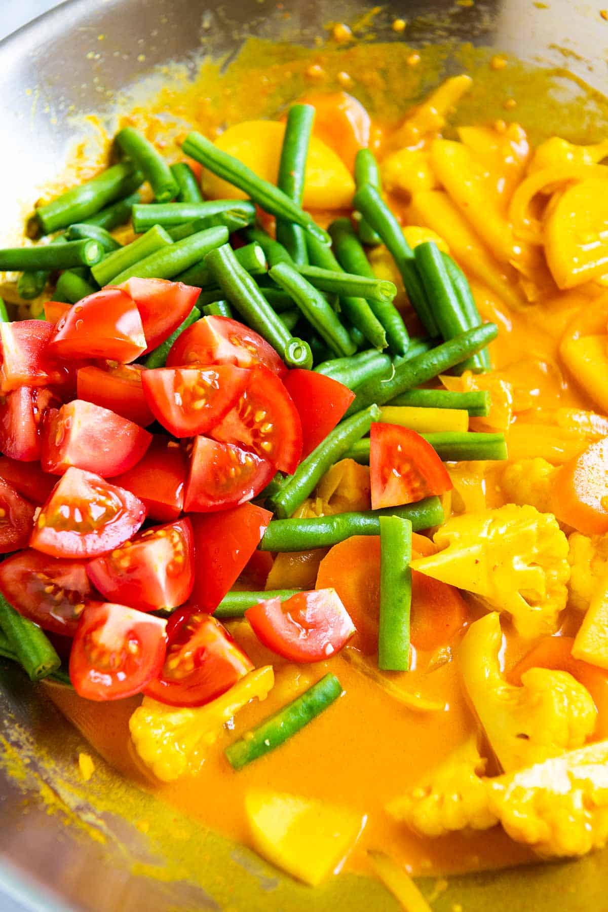 Easy Vegetable Curry - Tossing in fresh tomatoes and green beans