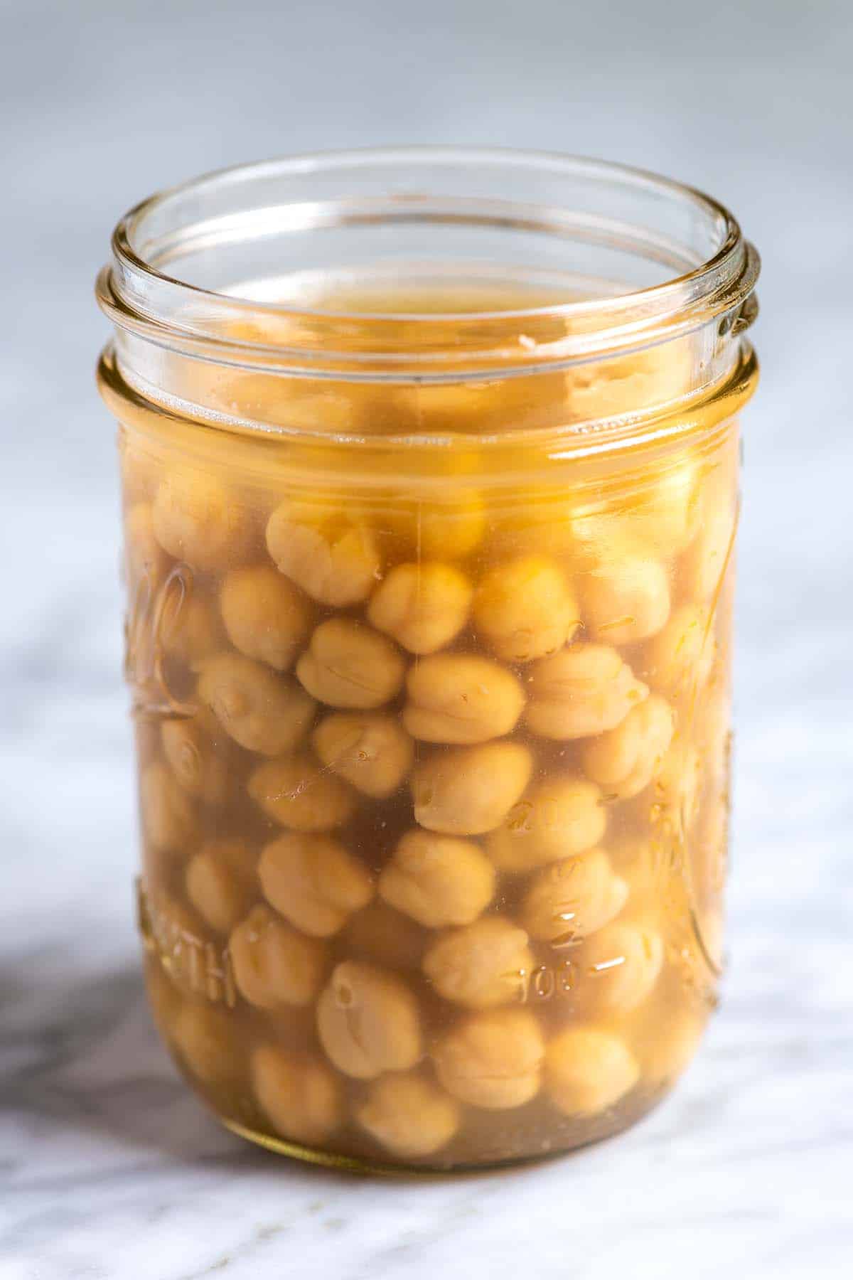 Jar of cooked chickpeas and aquafaba
