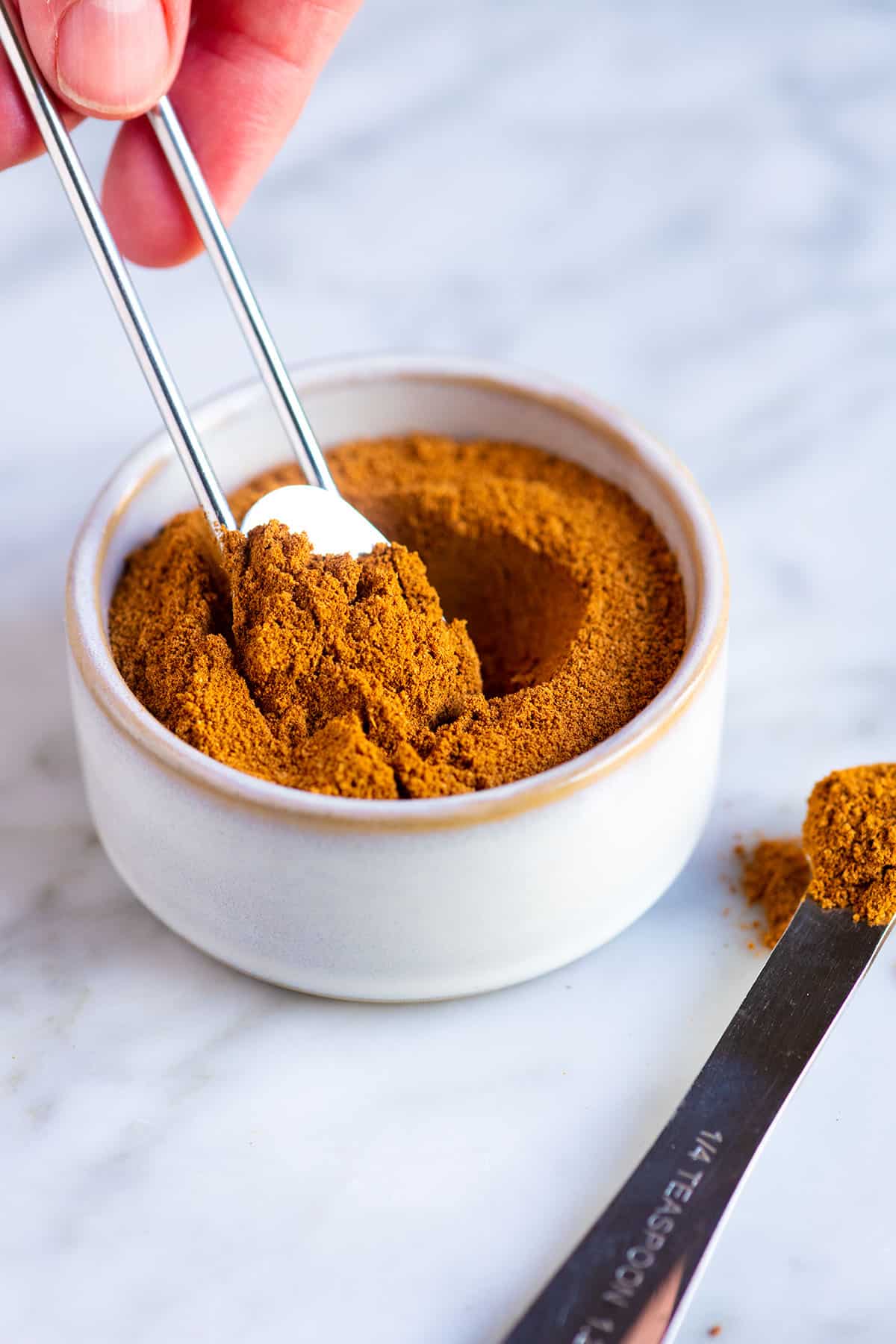 Measuring out some homemade pumpkin pie spice