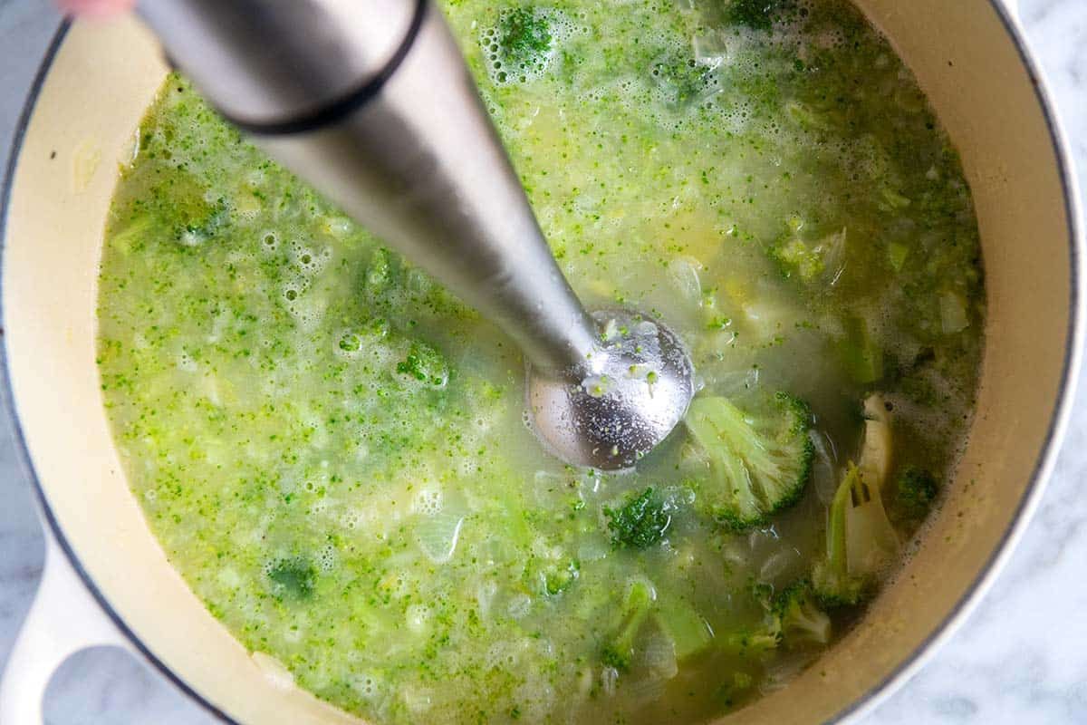 How to Make Broccoli Cheddar Soup: Blending soup ingredients with an immersion blender