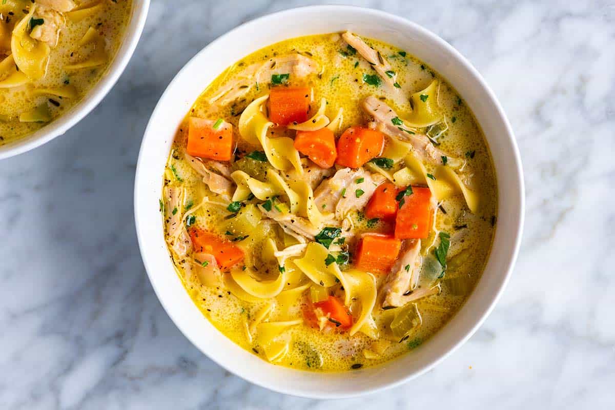 A bowl of creamy chicken noodle soup
