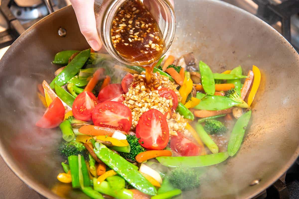 Adding the stir fry sauce