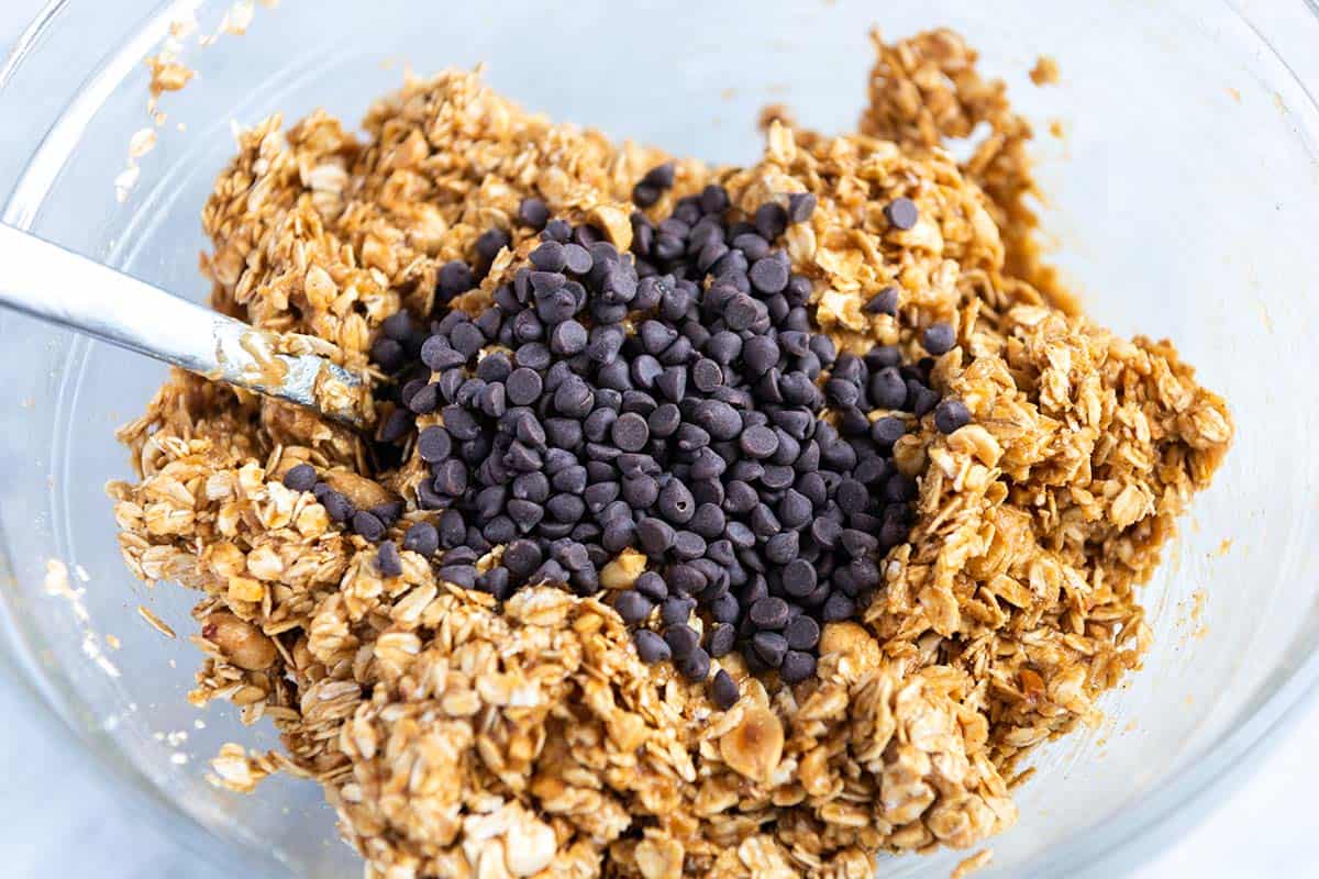 Adding mini chocolate chips to the peanut butter granola bar mixture