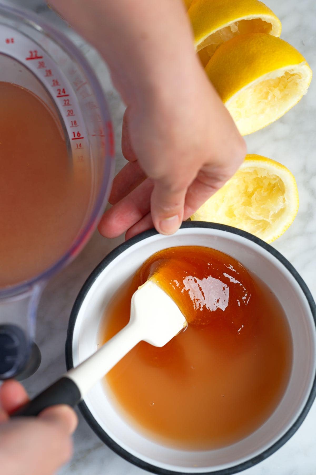 Stirring honey into ginger and lemon 