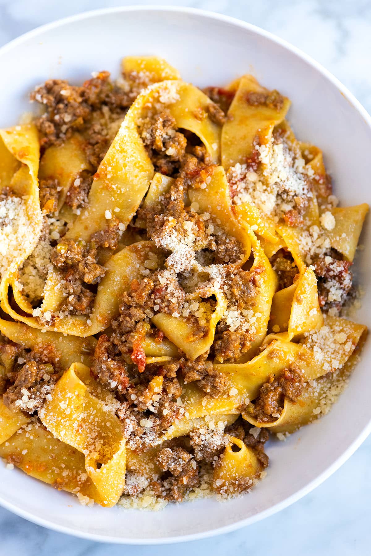 A plate of pasta with bolognese sauce