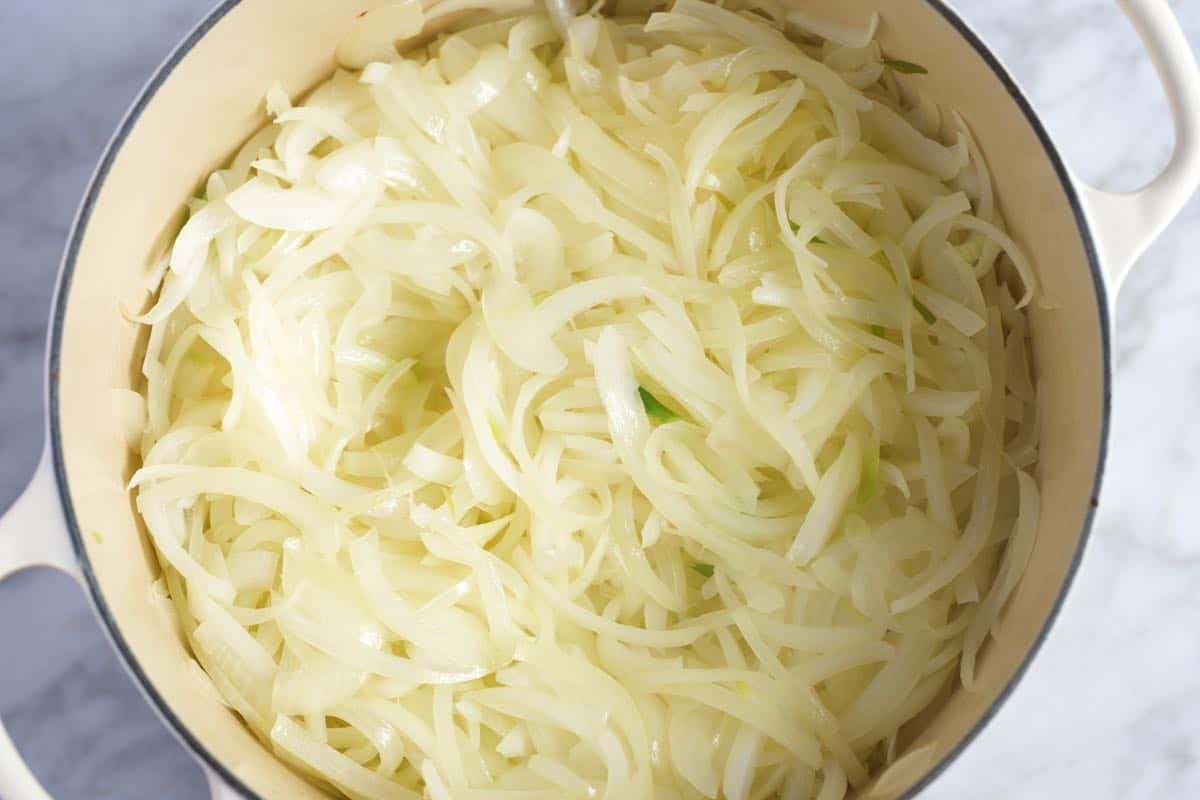 How to make French onion soup step 2 - sweating the onions in the pan with butter