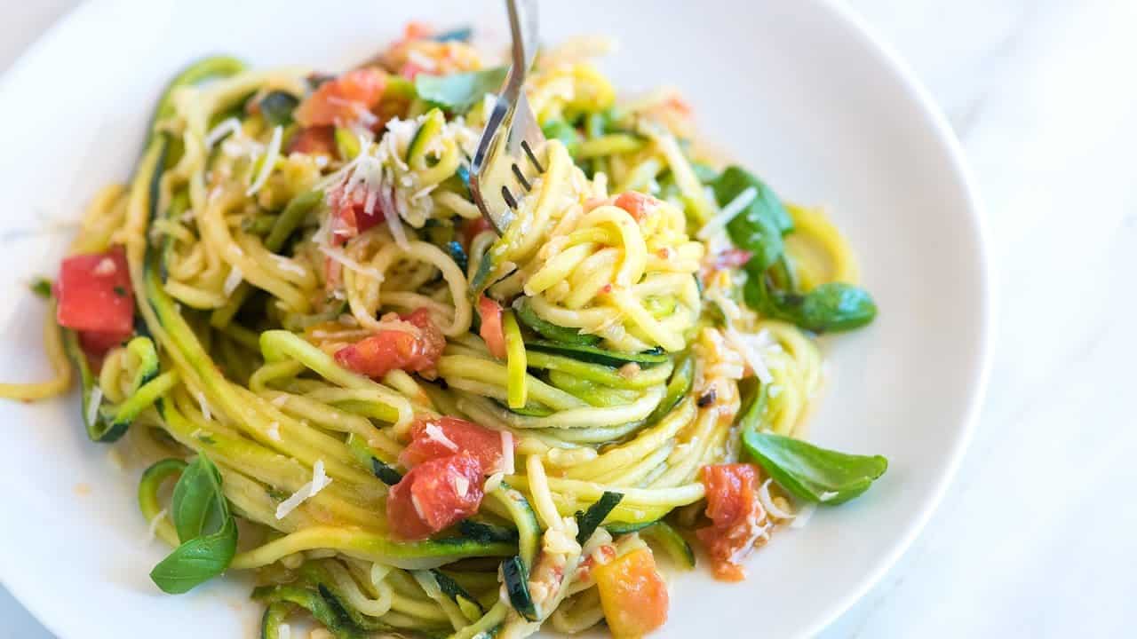 Making zucchini noodles with spiral vegetable slicer Stock Photo