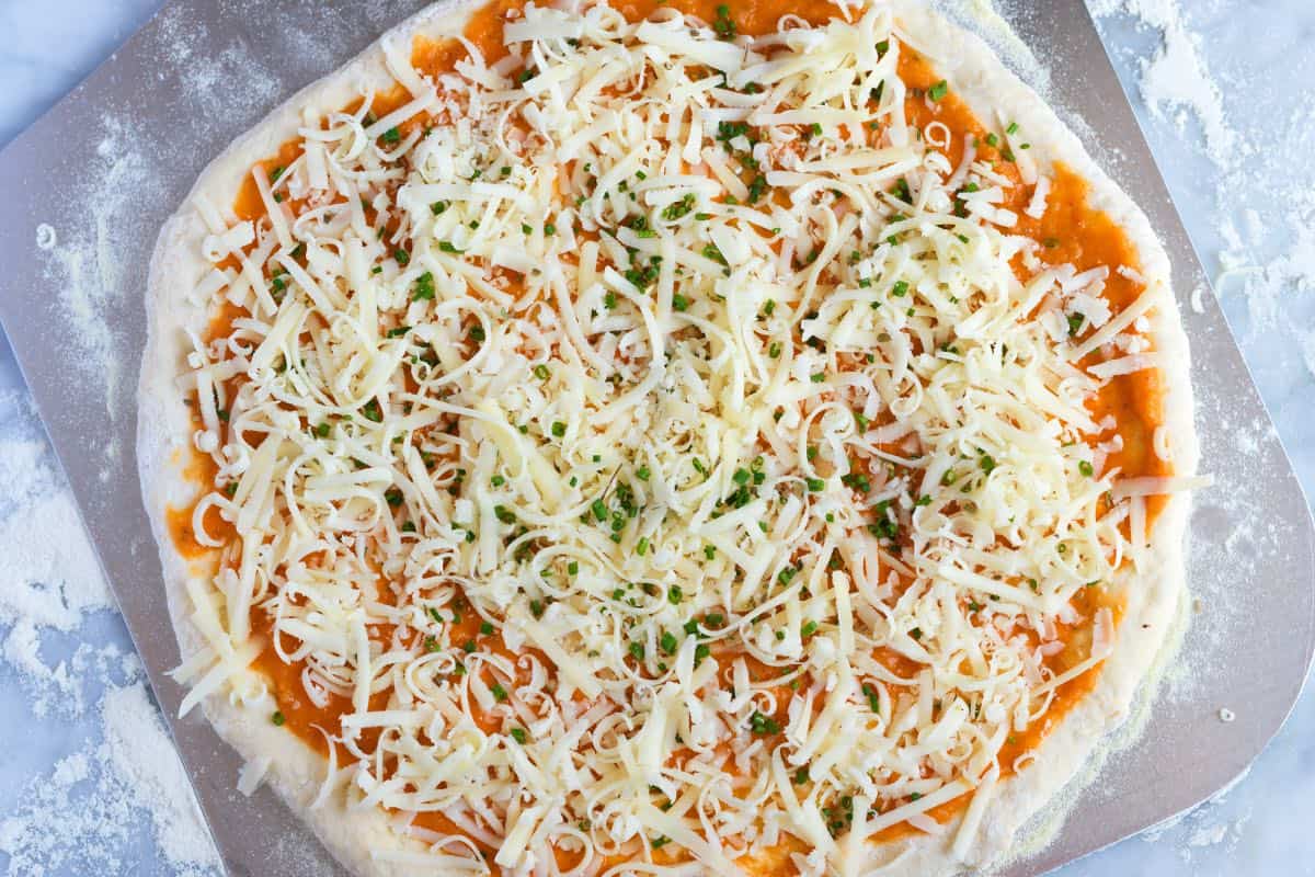 Cheese pizza ready to be baked