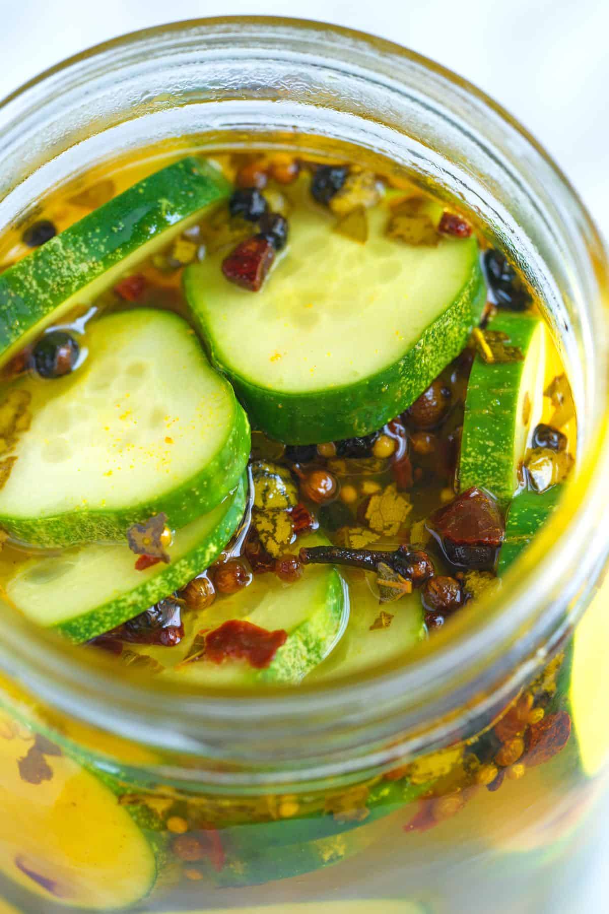 Sliced cucumbers with hot brine