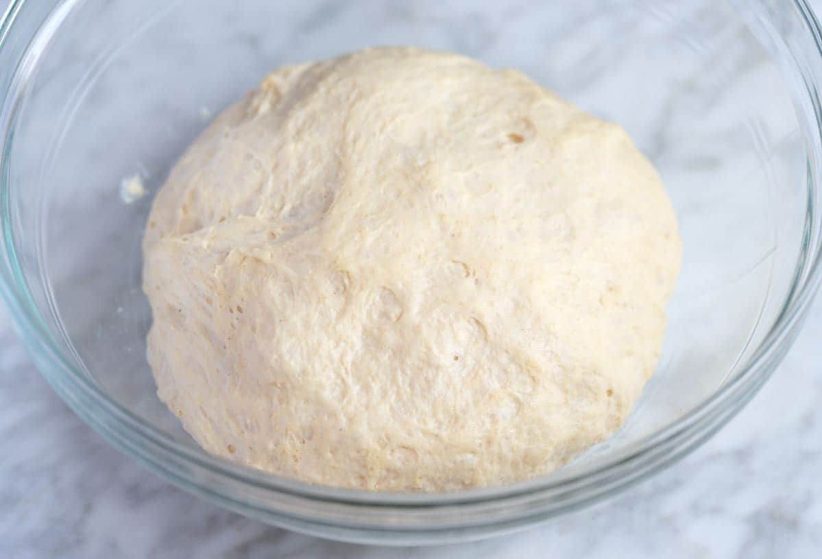 proofed homemade pizza dough that's ready to stretch and roll out.