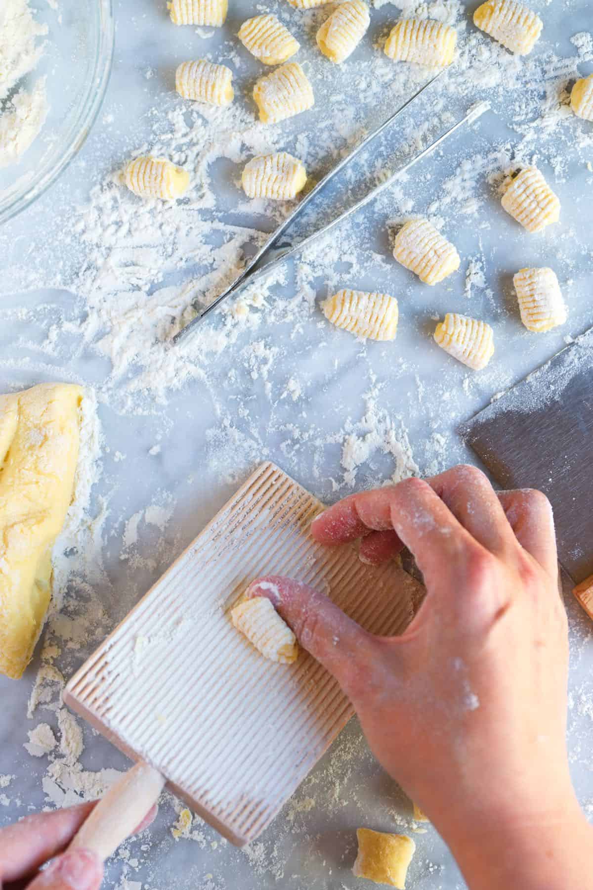 Rolling gnocchi on a gnocchi board