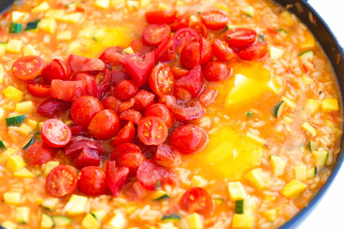 Adding tomatoes to risotto