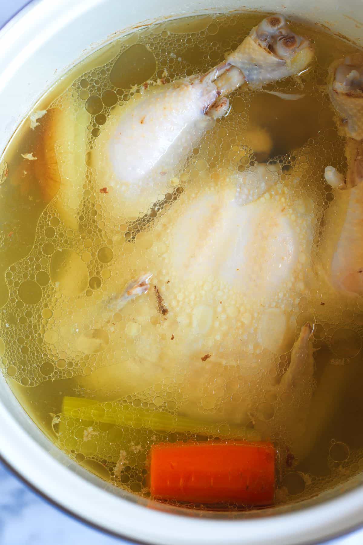 Chicken broth and chicken for homemade chicken and dumplings