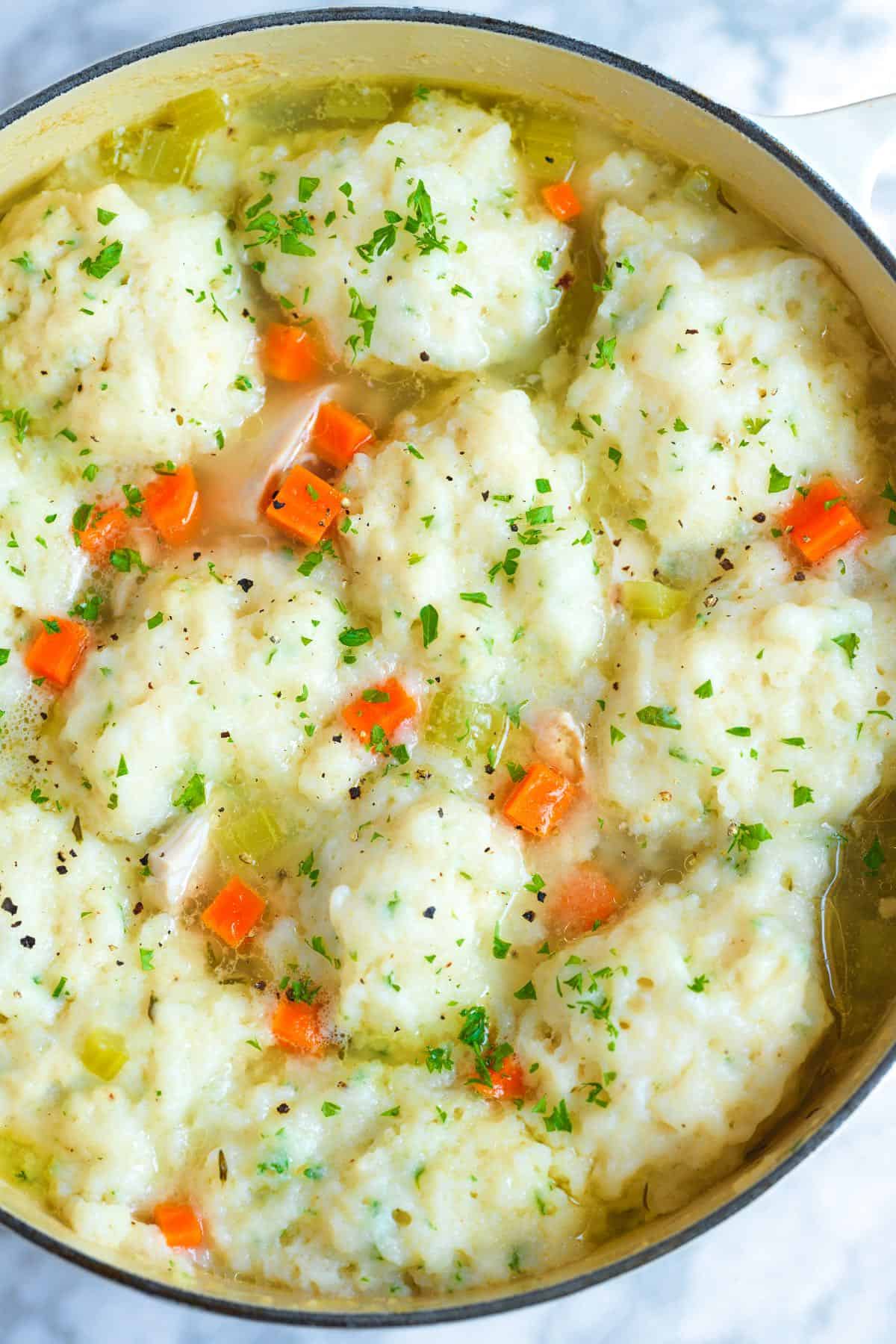 Drop Dumplings cooking in broth with chicken for chicken and dumplings