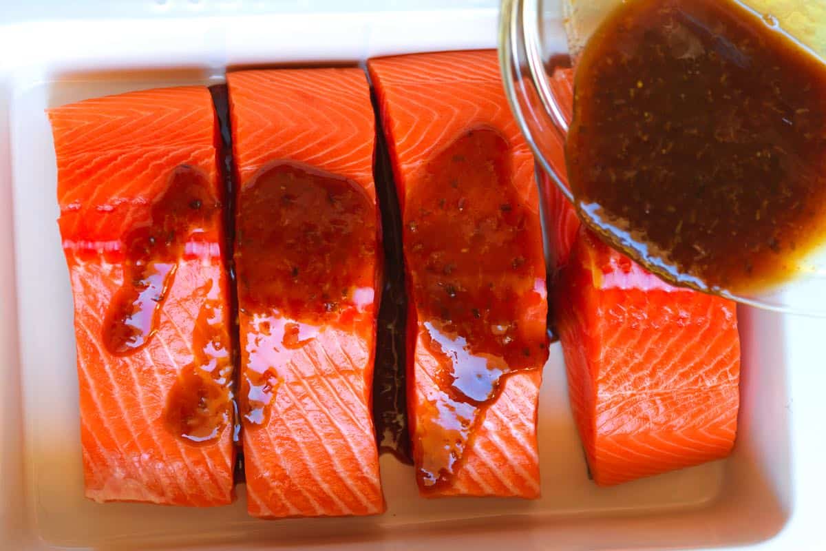 Adding the glaze to our salmon fillets