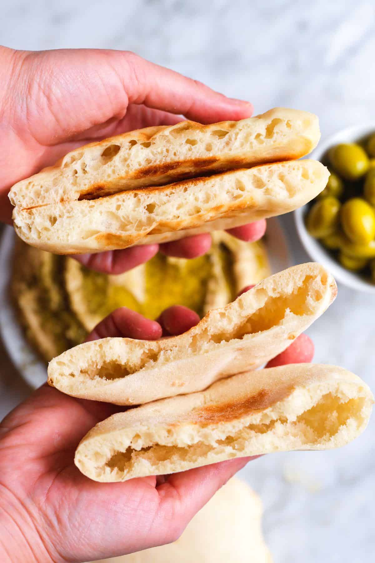 Pita cooked on the stove (on top of photo) and pita with a pocket cooked in the oven (bottom of photo)