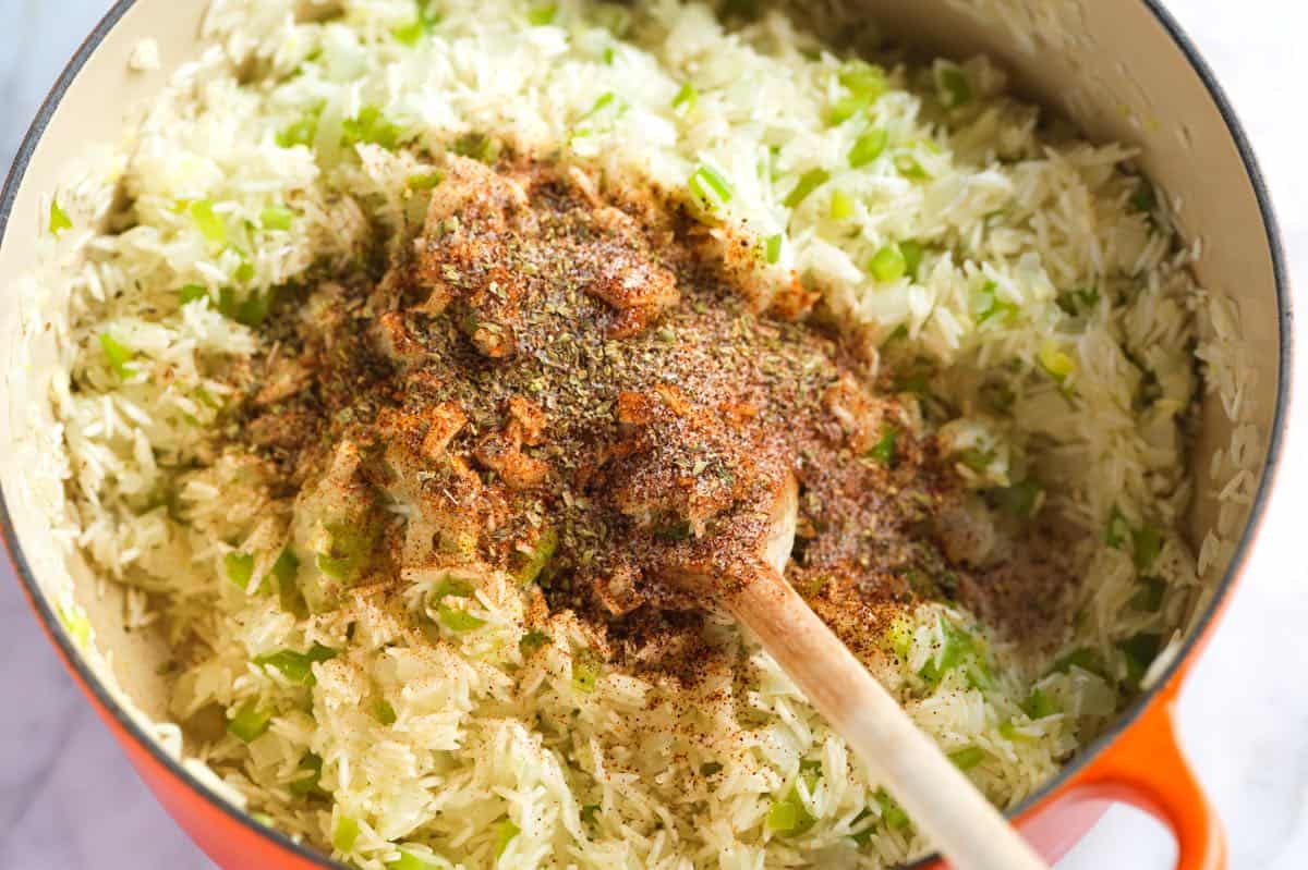 Toasting long-grain rice with spices for Mexican rice