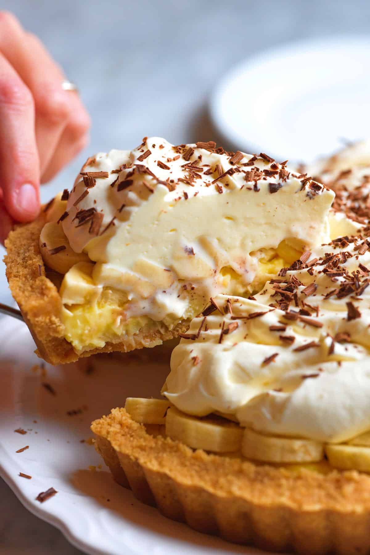 Cutting into homemade banana cream pie