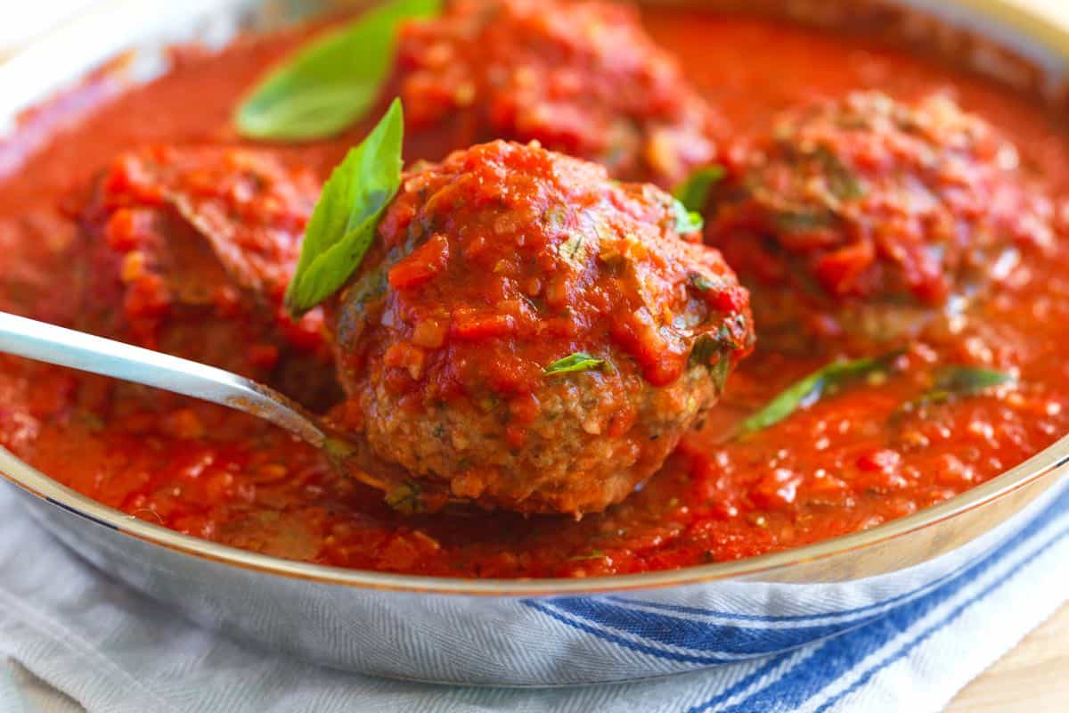 Italian meatballs cooked in homemade tomato sauce