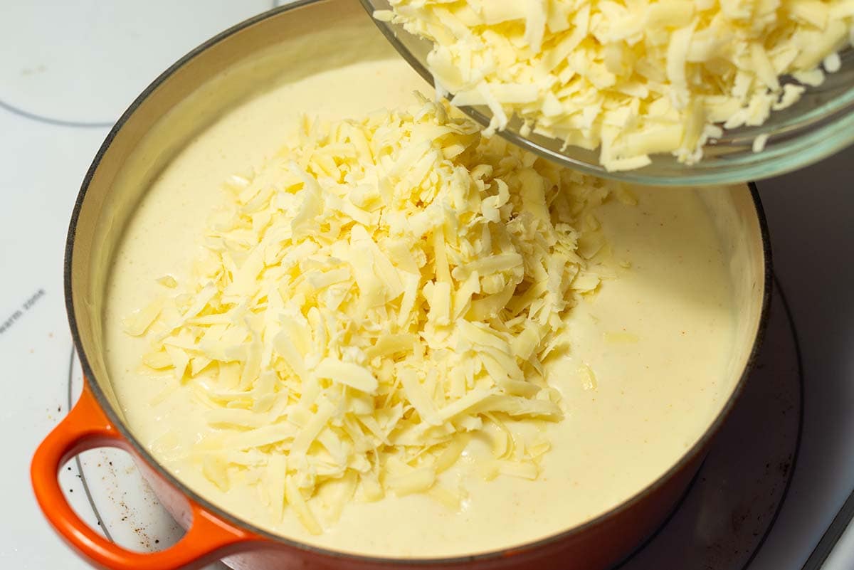 Making cheese sauce for baked macaroni and cheese.