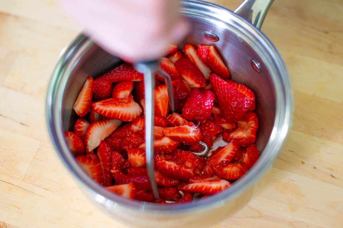 How to Make Strawberry Pie - Mashing strawberries for the strawberry glaze.